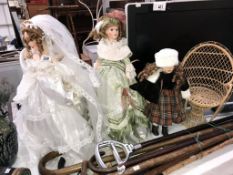 3 porcelain dolls and a dolls chair,