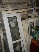 A large quantity of assorted window frames.