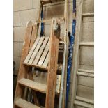 A wooden step ladder and 3 others.