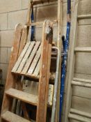 A wooden step ladder and 3 others.