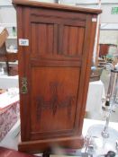 A mahogany pot cupboard.