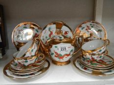 A Japanese egg shell china tea set (missing 2 teacups)