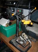 A bench drill,
