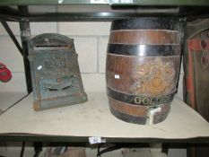 A cast iron letter box and an old barrel,