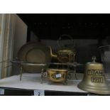 A brass kettle on stand, a brass trivet and other brass ware.