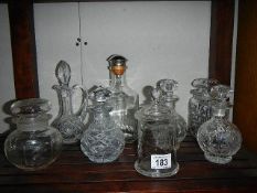 A mixed lot of cut glass liquor/perfume decanter, jars etc.