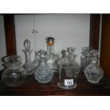 A mixed lot of cut glass liquor/perfume decanter, jars etc.