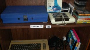 A Commodore 64 computer, 50 games and accessories, in working condition.