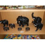A collection of wooden elephants.