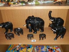 A collection of wooden elephants.