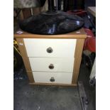 A 3 drawer bedside chest.