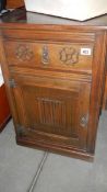 An oak bedside cabinet.