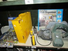 A mixed lot of tools including hand held circular saw, storage box & rack, welding electrodes,