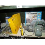 A mixed lot of tools including hand held circular saw, storage box & rack, welding electrodes,