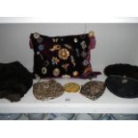 A collection of costume jewellery, 3 clutch bags, compact and fur hat with shoulder cape.
