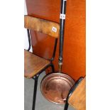 A copper warming pan.