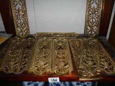 A quantity of ornate brass door finger plates,.