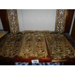 A quantity of ornate brass door finger plates,.