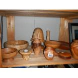 A shelf of assorted wooden items.