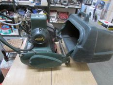 An Atco 14" petrol (electric start) cylinder mower with grass catcher,