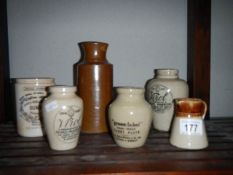 6 stoneware jars including advertising.