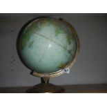 An old globe with longitude and mileage markers.