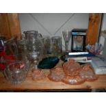 A shelf of assorted glass ware etc.
