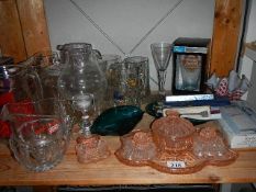 A shelf of assorted glass ware etc.