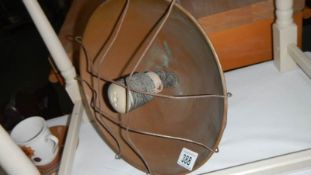 A vintage copper heat lamp.