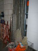 A quantity of metal scaffolding poles and brackets.