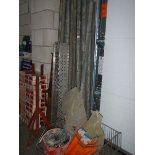 A quantity of metal scaffolding poles and brackets.