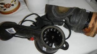 A gas mask and an engineer's phone.
