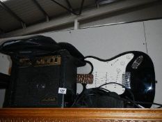 An electric guitar and amplifier.