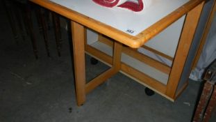 A drop leaf kitchen table,