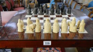 A chess table with chess set.