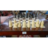 A chess table with chess set.