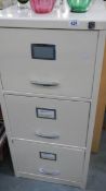 A 3 drawer painted filing cabinet.