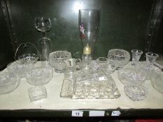 A mixed lot of glass ware including rose bowls, vases, butter dish etc.