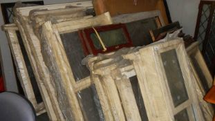 A large quantity of assorted window frames.