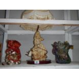 A figural table lamp and 2 dragon figures, one a/f.