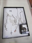 6 silver chains with assorted pendants and 2 silver pendants.