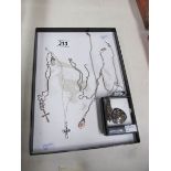 6 silver chains with assorted pendants and 2 silver pendants.