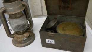 A 'Compact' primus stove in original box and a hurricane lamp.