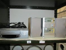 A Sharpe cassette mini hi-fi and a Pacific VHS video recorder.