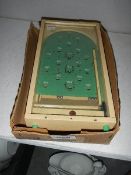 A vintage Chad Valley mini bagatelle game.