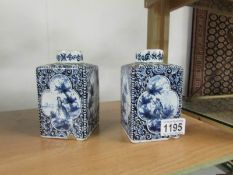 A pair of 19th century blue and white flasks (possibly Delft) a/f.