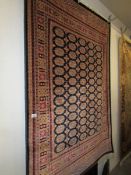A red ground Bokhara rug, 230 x 160 cm.