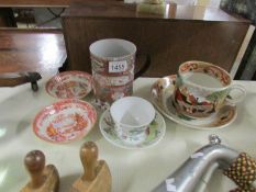 A large oriental tankard with metal handle, a large James Kent oriental pattern cup & saucer,