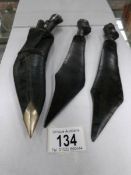 A miniature kukri with skinning knives and 2 carved wood letter openers.