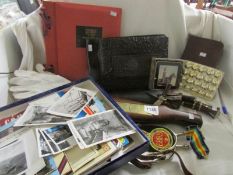 A collection of military militaria including 2 albums of WW2 photographs, set of buttons, postcards,